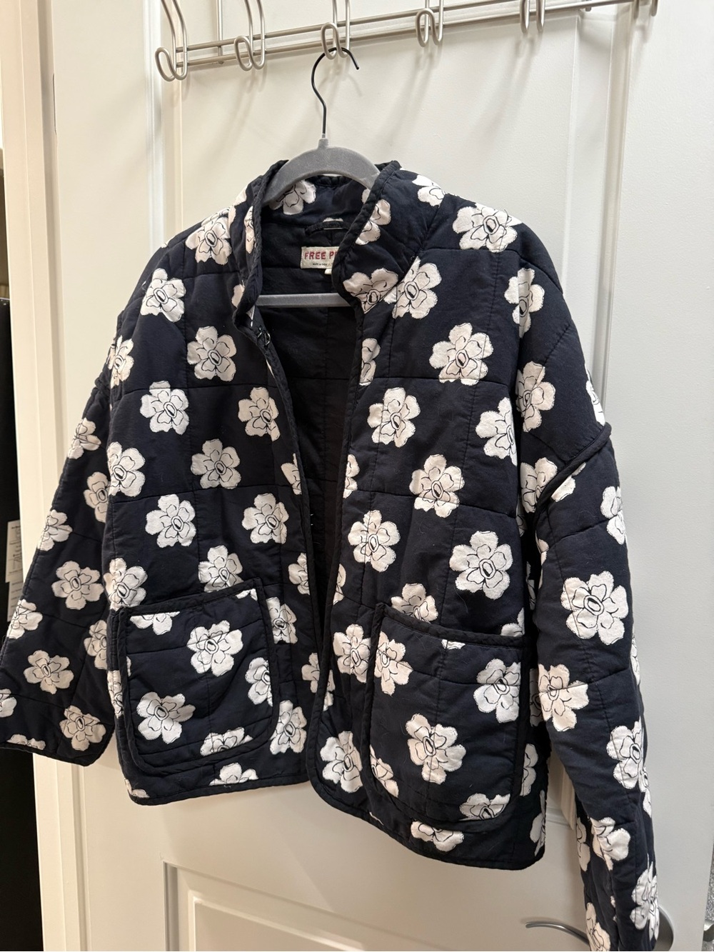 New without tags Free People Black Quilted Jacket with White Floral Accents